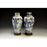 A pair of Chinese baluster vases, decorated in underglaze blue with figures, pagodas and bridge,