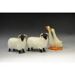 A Beswick black faced ram; another;