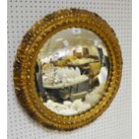 An early 20th century circular gilt framed mirror c 1920