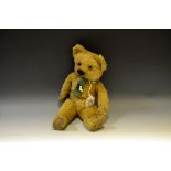 An early 20th century jointed mohair teddy bear,