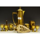 An Art Nouveau brass coffee pot; a set of four 19th century brass egg cups,