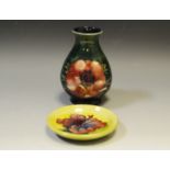 A Moorcroft Anemone pattern squat vase, blue banded ground, impressed and painted marks,