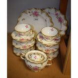 A Royal Crown Derby Royal Pinxton rose pattern six setting tea service, inc cups, saucers, sucrier,