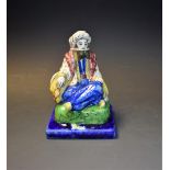 A 19th century glazed figure,