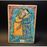 A 19th century Persian rectangular tile, decorated in the Iznik palette with a courting,