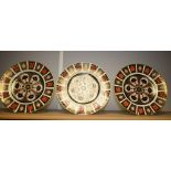 Royal Crown Derby - a set of three 1128 imari plates, 27cm diameter,
