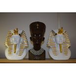 A pair of contemporary ceramic Egyptian masks; another,