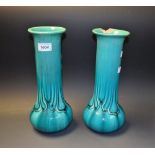 A pair of Bretby Art Nouveau cylindrical vases, drip glazed in turquoise blue, 31cm high,