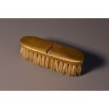 A miniature ruby and spinel mounted 14ct gold backed moustache brush,