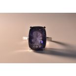 A natural blue spinel solitaire ring, 15,82ct measuring 15.53 x 11.71 x 9.22 mm, box collet.