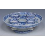 A Spode egg cup stand and four cups, transfer printed in tones of blue with mausoleum,