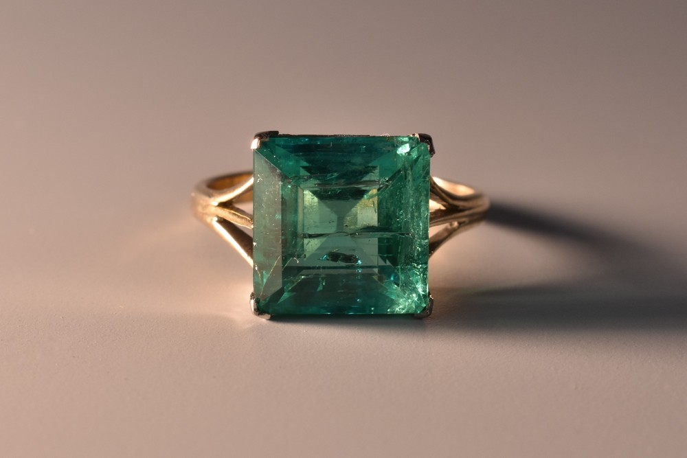 A Columbian square emerald cut emerald solitaire ring, 7.09ct measuring 11.50 x 11.35 x 7.