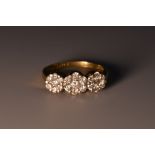 A diamond trilogy head floral cluster ring,