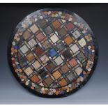A pietra dura circular table top, the centre inlaid with a geometric field of lapis lazuli,