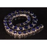 A graduating sapphire and diamond necklace,