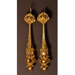 A pair of chandelier droplet yellow metal earrings, tapering textured body with floral,