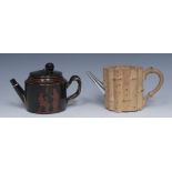 An English caneware bamboo teapot, picked out in brown, silver metal spout, 9.