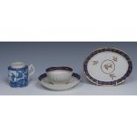 A Salopian fluted tea bowl and saucer, banded in cobalt blue, applied in gilt with strapwork,