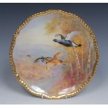 A late 19th century English porcelain plate, painted by J.