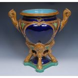 A Victorian majolica urnular jardiniere, probably Minton, moulded with strapwork,