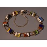 A 9ct gold enamelled panel bracelet, each enamelled with a different flag or symbol,