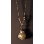 A natural salt water pearl and diamond pendant necklace,