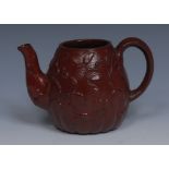 An 18th century red moulded stoneware lobed globular tea pot,