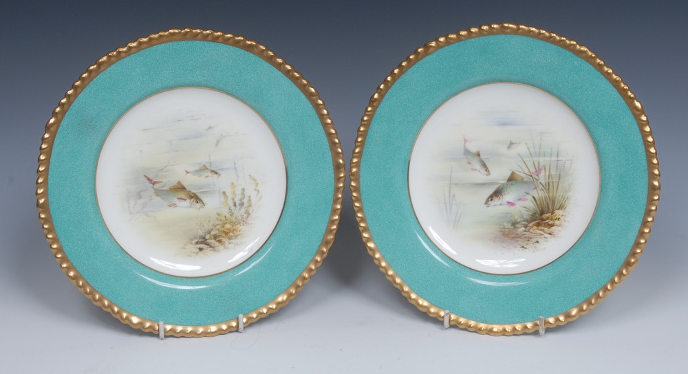 A pair of Wedgwood shaped circular plates, painted by Holland, signed, with Roach and Barbel,