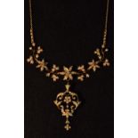 An Edwardian 15ct gold diamond and seed pearl pendant necklace and brooch suite,