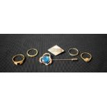 A 9ct gold eternity ring; other dress rings; a mother-of-pearl navette shaped brooch,