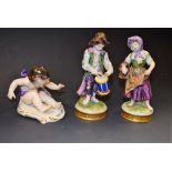 Continental figures - a pair, Drummer and Apple Girl, gilt circular bases, 20th century; another,