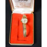 Omega - a ladymatic 14ct gold plated bracelet watch, brushed dial, baton markers,