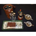 A leather cased set of three liquor flasks,