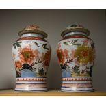 A pair of Chinese lidded jars,