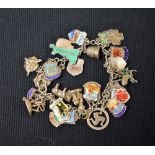 A silver charm bracelet, 27 charms,