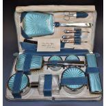 A lady's travelling dressing table set in chrome and faux blue enamel, comprising clothes brush,