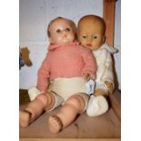 An early 1940's American doll, fabric body, composite limbs and head, sleeping eyes,