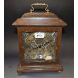 A contemporary Fox & Simpson oak cased bracket clock, silvered dial and spandrels, Roman numerals,