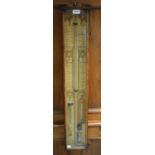 A Victorian oak Admiral Fitzroy barometer, paper register printed in the Gothic taste, 94cm long, c.
