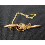A late Victorian bar brooch, 15ct, set with garnets and seed pearls, approx.