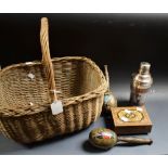 A plated cocktail shaker; a wicker basket; a pair of maracas;