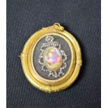 A large 19th century pinchbeck oval brooch,