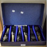 A cased set of six 1970s Fortnum & Masons small Champagne bottles with contents, dated 1973,