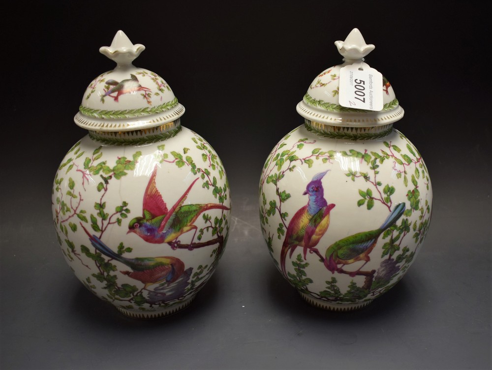 A pair of Victorian globular vases and covers,