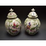 A pair of Victorian globular vases and covers,