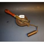 An early 20th century German well depth measure, by Herbind, turned boxwood handle, brass bob,