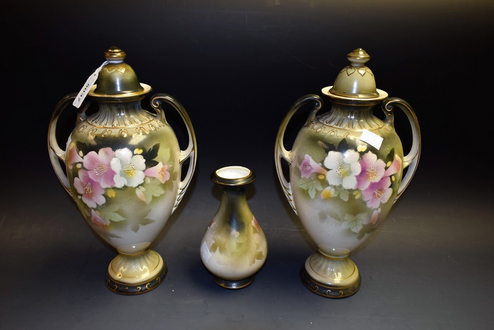 A pair of Victorian two handled vases; another,
