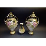 A pair of Victorian two handled vases; another,