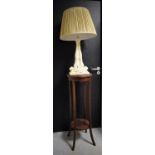 An Edwardian mahogany torchere and a figural table lamp (2)