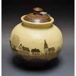An Art Pottery vase and cover, village trees landscape,